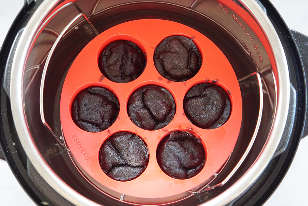 Brownie bite mold in the Instant Pot with cooked bites.