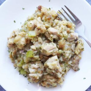 A helping of chicken stuffing casserole on a plate.