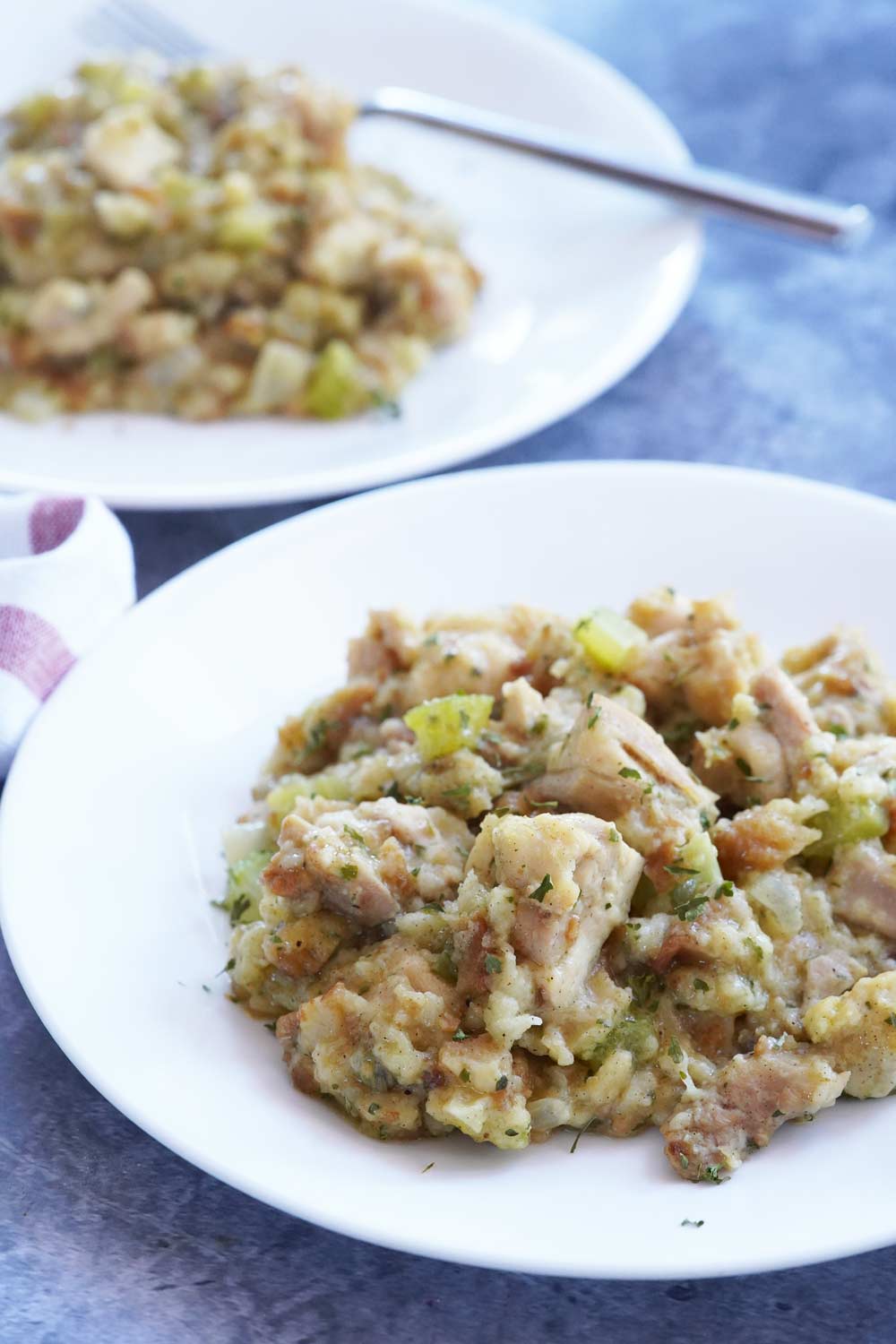 A helping of chicken stuffing casserole on a plate.