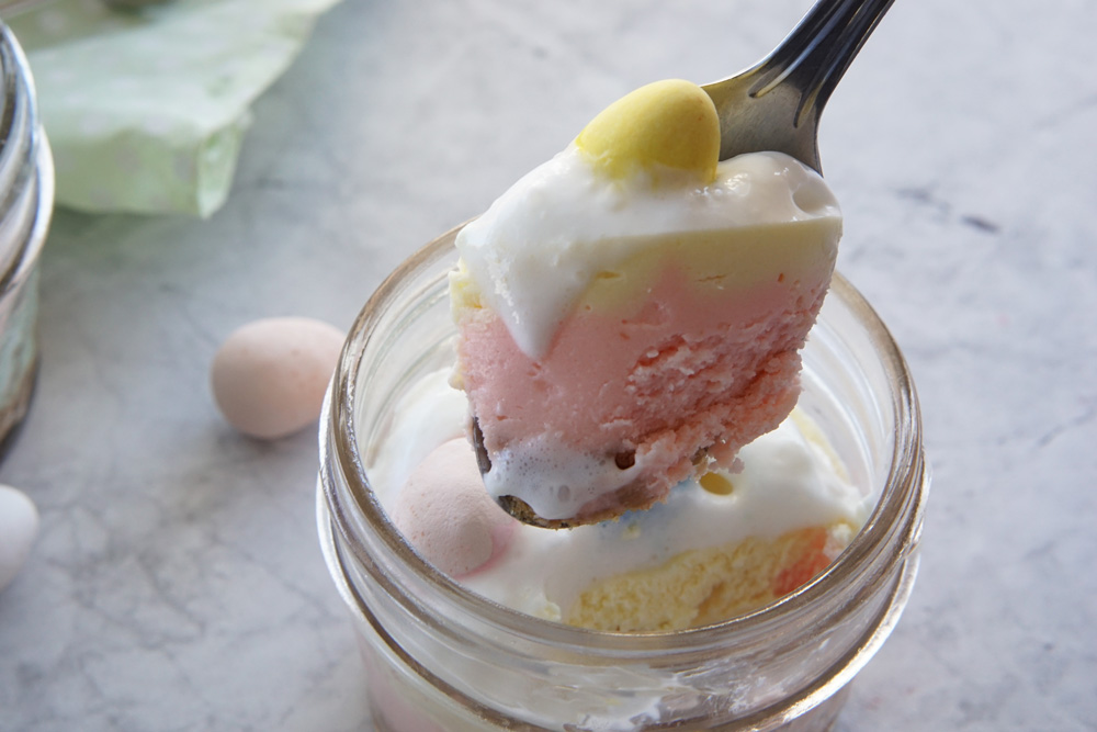 a spoonful of Easter cheesecake in a jar