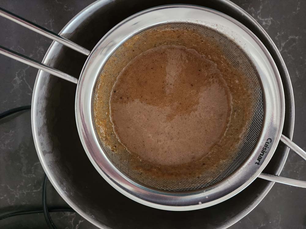 Making gravy from the lamb shanks cooking liquid