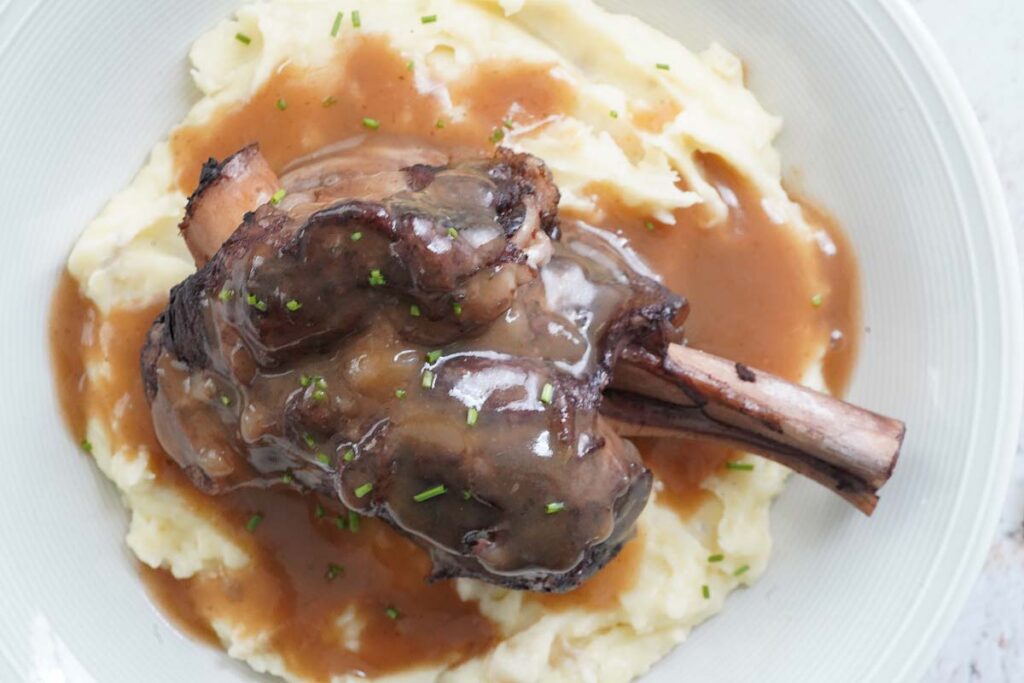 Lamb shank over mashed potatoes and gravy