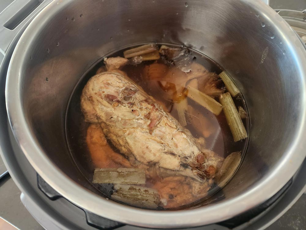All the ingredients in the Instant Pot to make the broth.